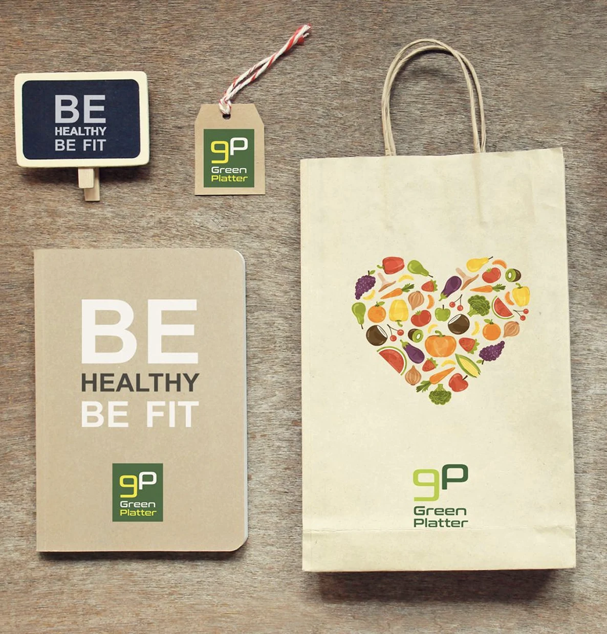 Green Platter identity applied to packaging, tags, notebook, and sign